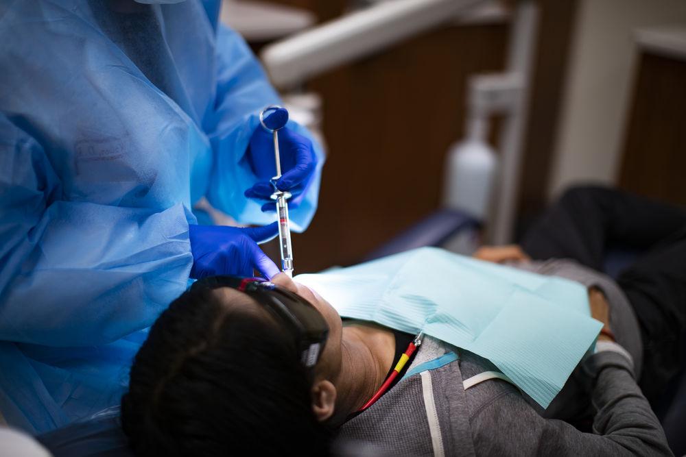 A patient in the Kornberg School of Dentistry receiving periodontics work. 